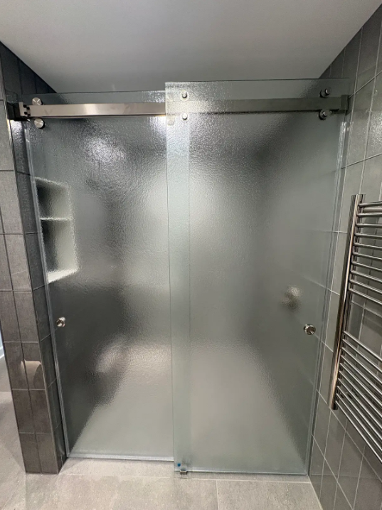 This is a custom cast glass from HMI Cardinal called Tranquility. It is low iron glass which means it has improved clarity and a reduced iron content which makes it less green!